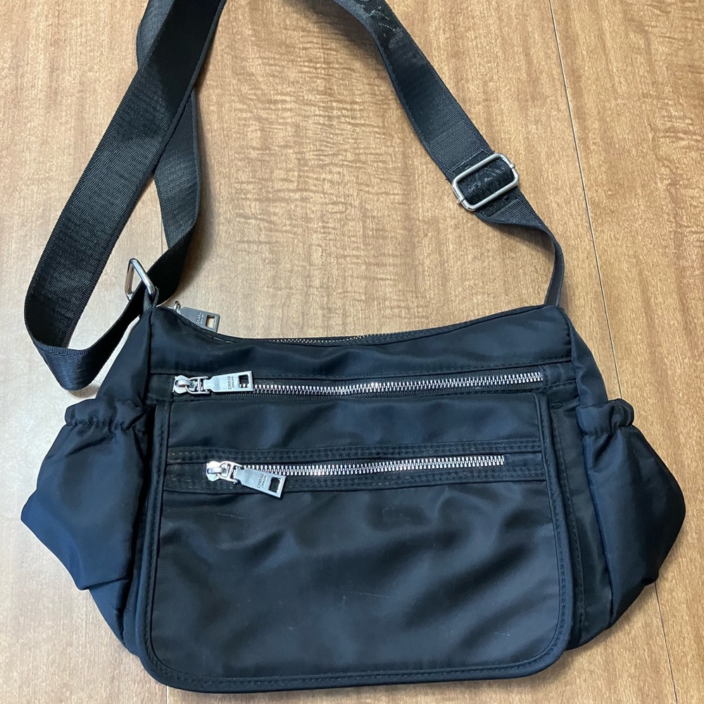 Black Crossbody Bag with Adjustable Strap and Minimalist Design